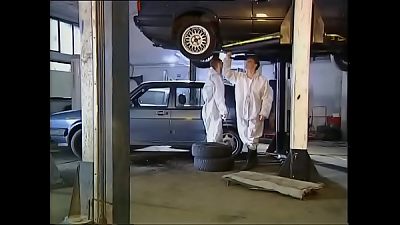 High class woman plumbed by mechanics in garage