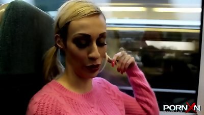 light-haired Chessie Kay walking with raw pants