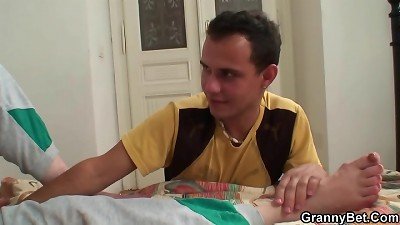 Injured senior grandmother getting healed by young prick